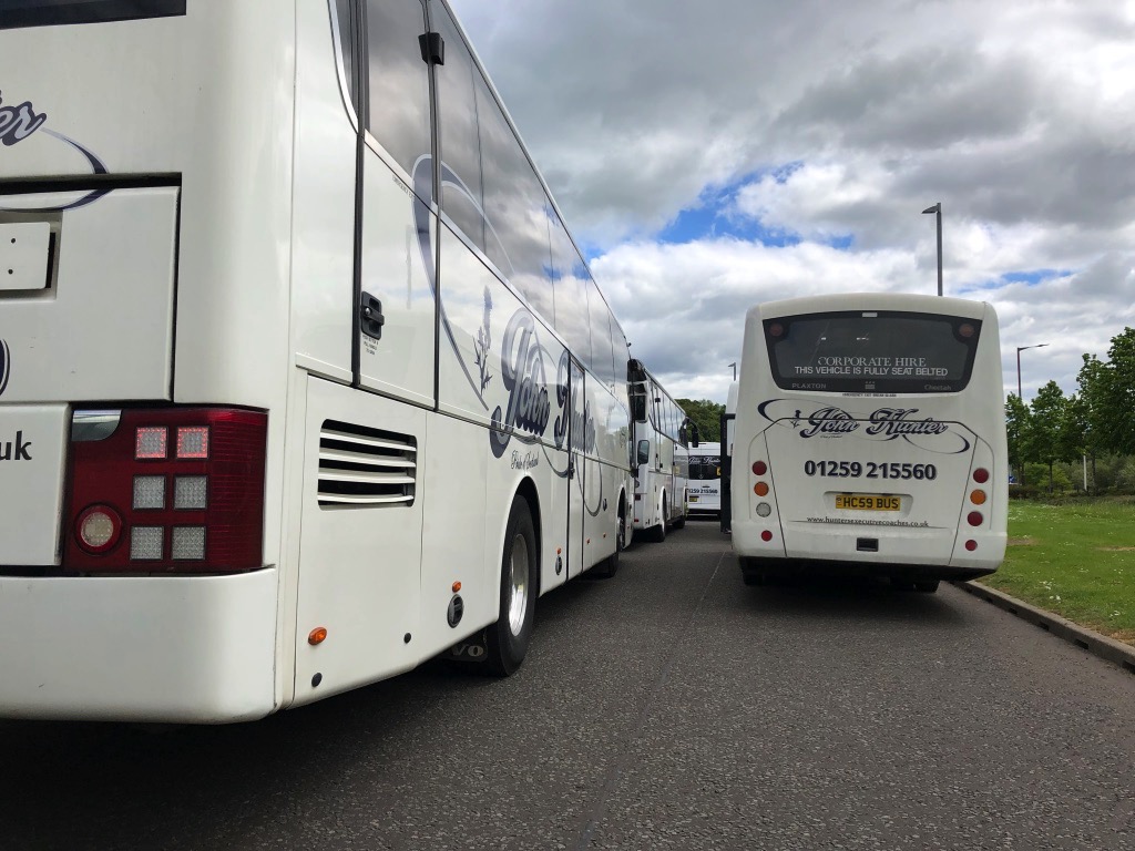 A number of our coaches parked waiting to pick up from an event